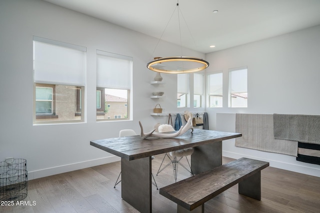 dining room featuring recessed lighting, baseboards, and wood finished floors