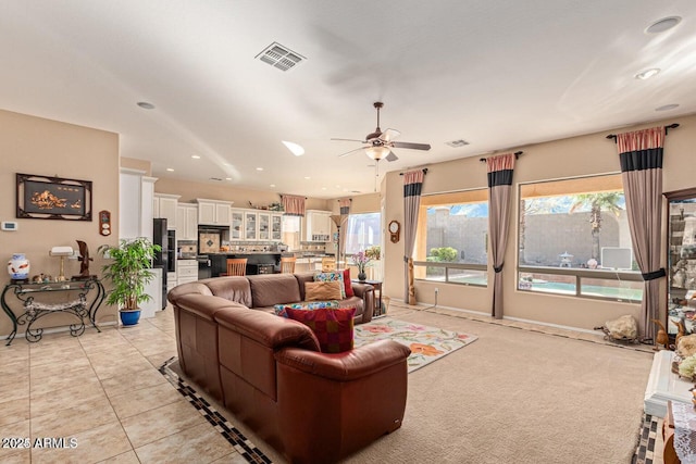 living room featuring light tile patterned floors, visible vents, recessed lighting, and a ceiling fan