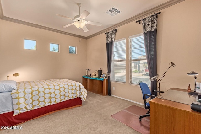 carpeted bedroom with ceiling fan, visible vents, baseboards, and ornamental molding