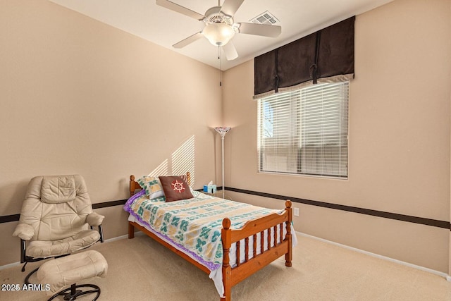 bedroom with visible vents, carpet floors, baseboards, and a ceiling fan