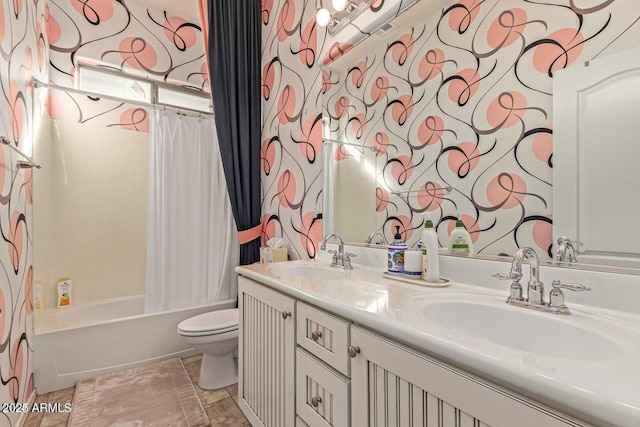 bathroom with wallpapered walls, toilet, shower / bathtub combination with curtain, and a sink