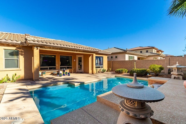 view of pool featuring a patio area, a fenced in pool, and fence