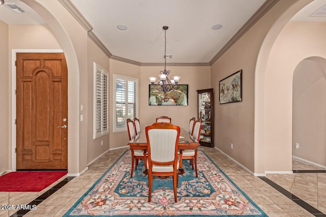 dining room with visible vents, an inviting chandelier, crown molding, and baseboards