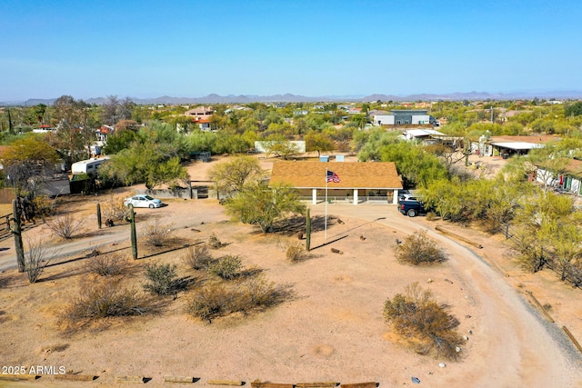 birds eye view of property with a mountain view