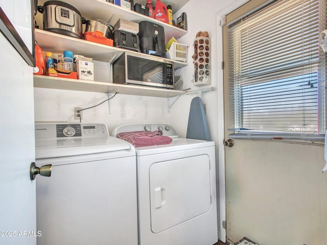 laundry room with laundry area and washing machine and dryer