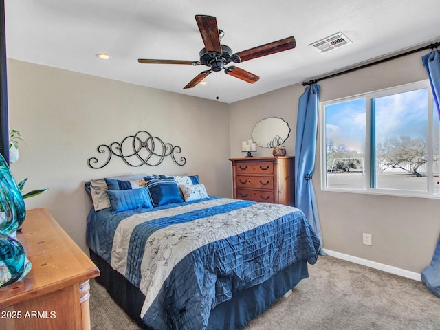 carpeted bedroom featuring visible vents, ceiling fan, and baseboards