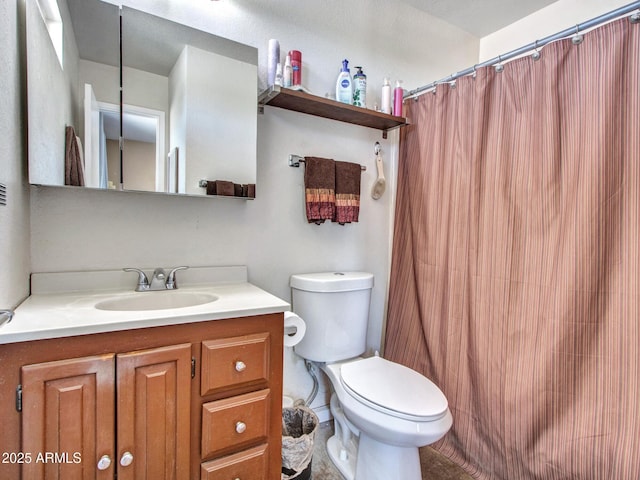 full bathroom with vanity, toilet, and a shower with curtain