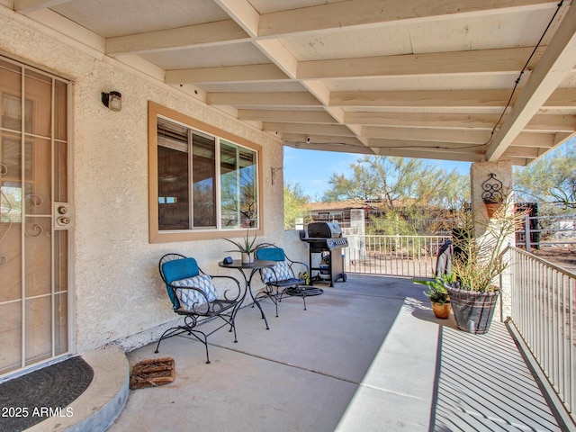 view of patio / terrace featuring grilling area and a balcony