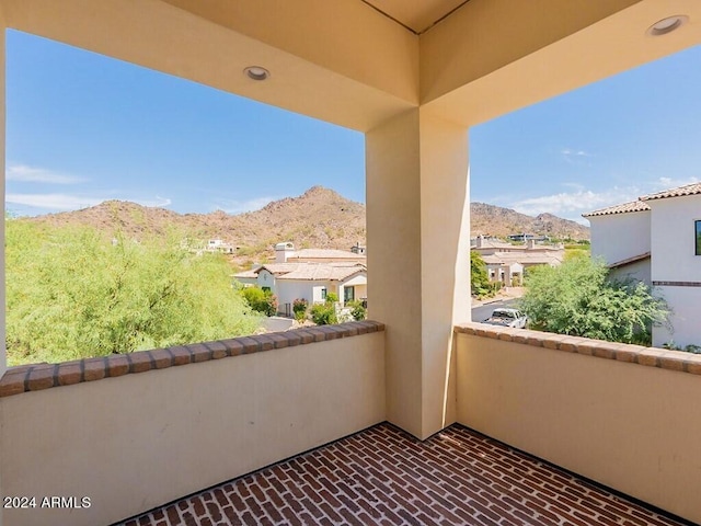 balcony with a residential view and a mountain view