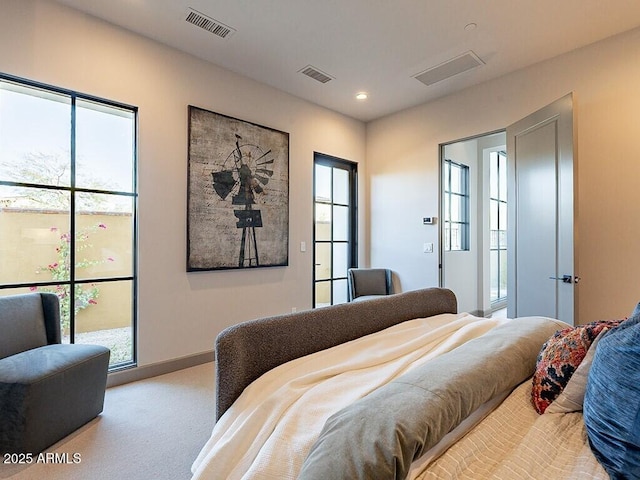 carpeted bedroom featuring baseboards, visible vents, and recessed lighting