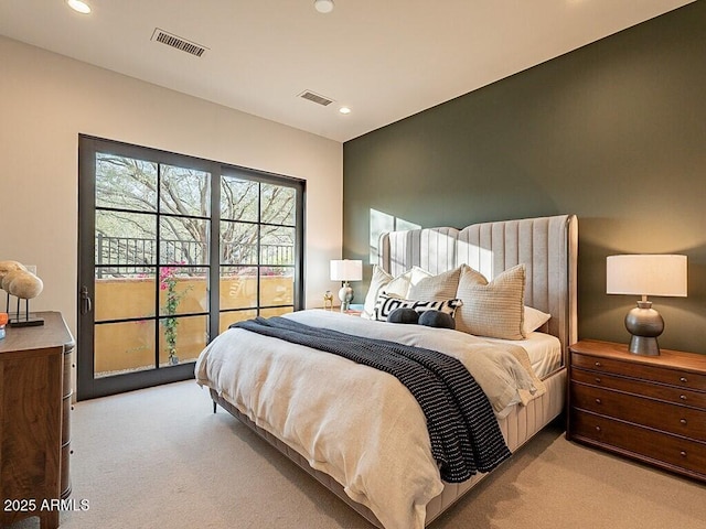 bedroom with light carpet, visible vents, and recessed lighting