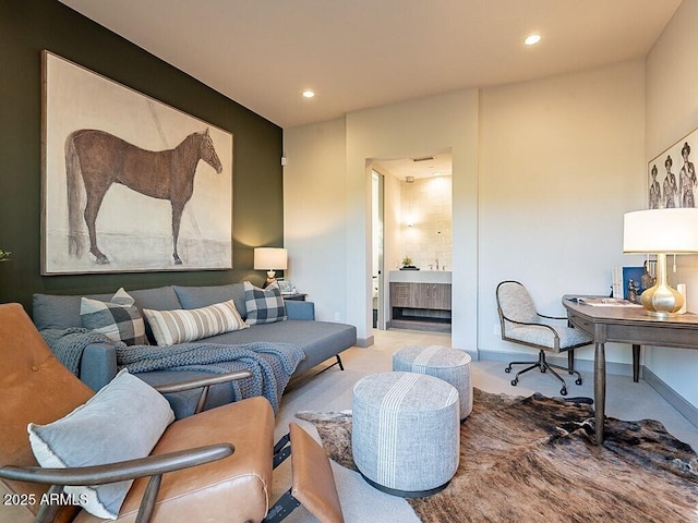 living area with carpet floors, recessed lighting, and baseboards