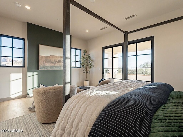 bedroom featuring multiple windows, visible vents, and recessed lighting