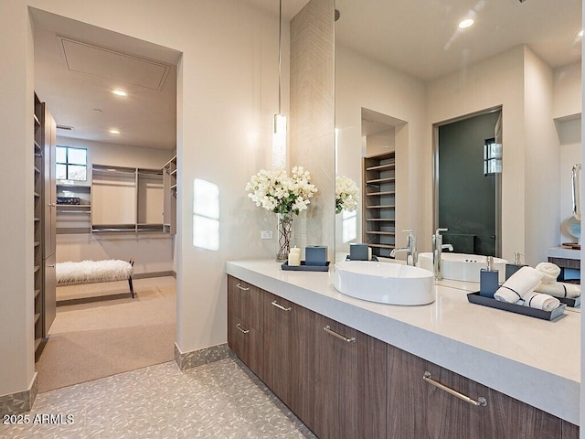 bathroom with recessed lighting, baseboards, and vanity