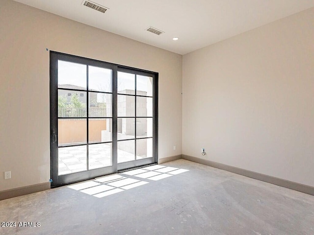 unfurnished room with baseboards, concrete floors, visible vents, and recessed lighting