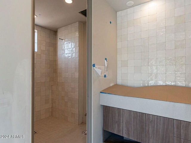 bathroom with recessed lighting and a tile shower