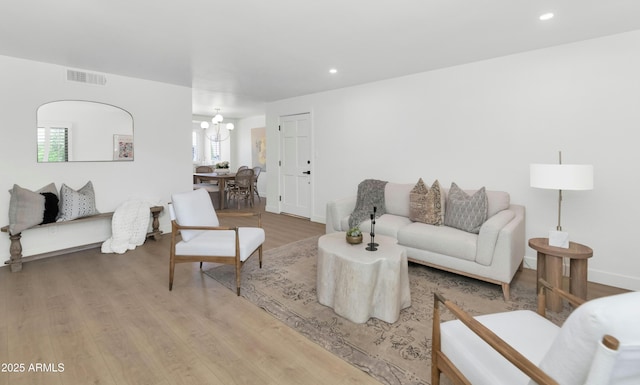 4201 E Camelback Rd Unit 70, Phoenix, AZ 85018 - living room featuring wood finished floors, a chandelier, recessed lighting, and baseboards