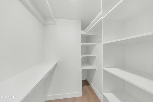 4201 E Camelback Rd Unit 70, Phoenix, AZ 85018 - spacious closet with wood finished floors