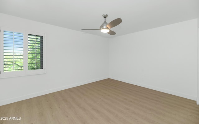 4201 E Camelback Rd Unit 70, Phoenix, AZ 85018 - unfurnished room featuring light wood finished floors, ceiling fan, and baseboards