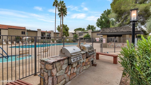 4201 E Camelback Rd Unit 70, Phoenix, AZ 85018 - view of patio with a community pool