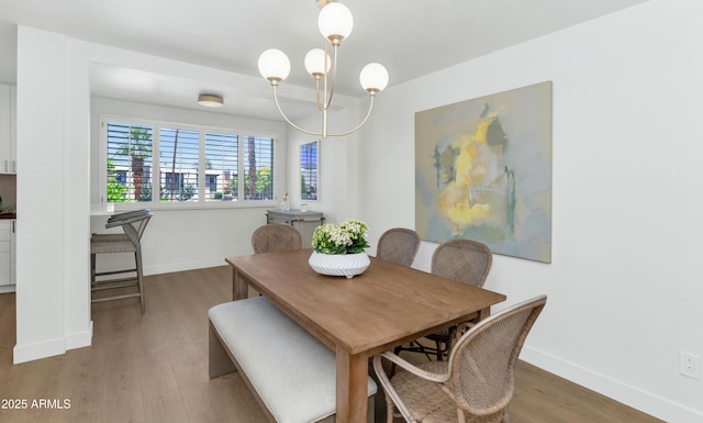 4201 E Camelback Rd Unit 70, Phoenix, AZ 85018 - dining space with light wood-style flooring and baseboards