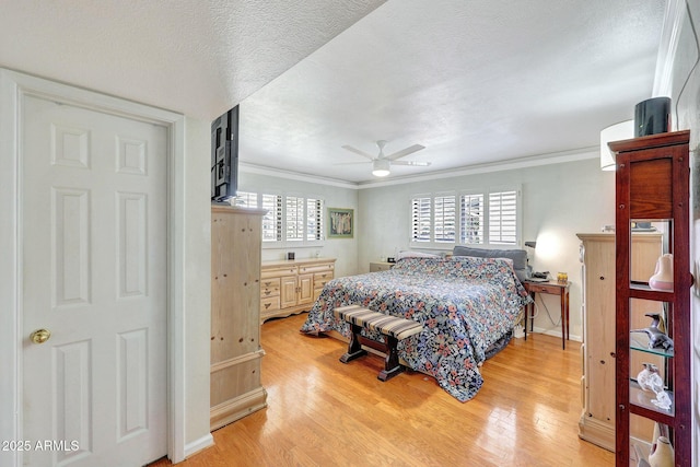 bedroom featuring light wood-type flooring, ornamental molding, and baseboards