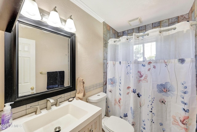 bathroom featuring tasteful backsplash, a shower with shower curtain, toilet, vanity, and visible vents