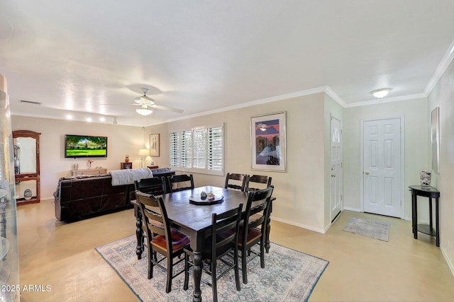 dining room with ornamental molding, finished concrete floors, baseboards, visible vents, and a ceiling fan