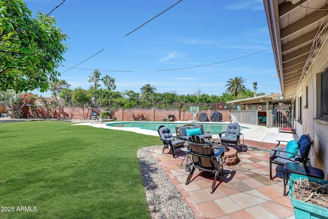 view of swimming pool featuring a lawn, a patio, a fenced in pool, and a fenced backyard