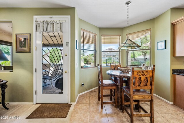 7342 E Norwood St, Mesa, AZ 85207 - dining room with light tile patterned flooring and baseboards