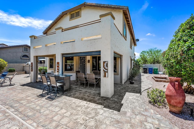 7342 E Norwood St, Mesa, AZ 85207 - rear view of house with a patio area, outdoor dining space, stucco siding, a balcony, and a tile roof