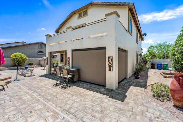 7342 E Norwood St, Mesa, AZ 85207 - rear view of property with a patio, outdoor dining space, and stucco siding