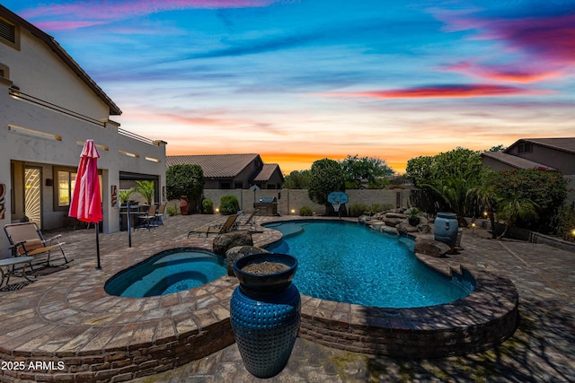 7342 E Norwood St, Mesa, AZ 85207 - view of swimming pool featuring a patio area, a pool with connected hot tub, and grilling area