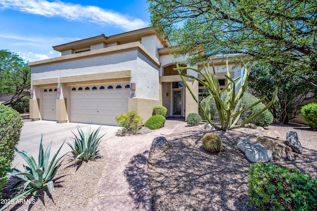7342 E Norwood St, Mesa, AZ 85207 - view of front of home with concrete driveway, a garage, and stucco siding