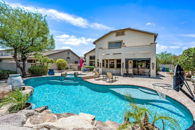 7342 E Norwood St, Mesa, AZ 85207 - view of pool featuring a patio area, a fenced backyard, a pool with connected hot tub, and outdoor dining space
