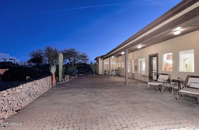 view of patio featuring fence