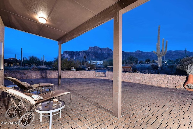 patio terrace at dusk with a mountain view