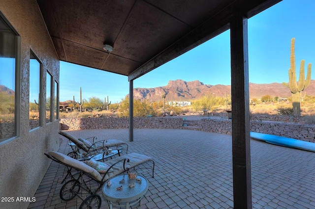 view of patio / terrace featuring a mountain view