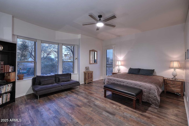 bedroom featuring a ceiling fan, baseboards, and dark wood-type flooring