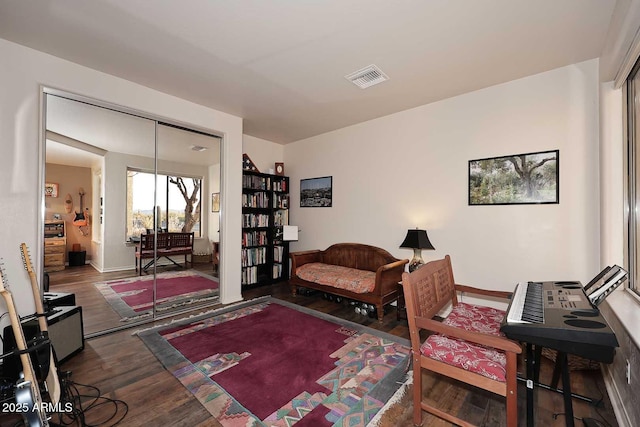 office with visible vents, baseboards, and wood finished floors