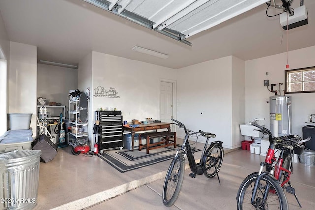 garage with a garage door opener and water heater