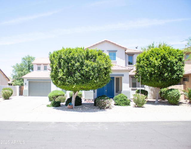 15148 W Sells Dr, Goodyear, AZ 85395 - view of front facade featuring a tiled roof, a garage, stucco siding, and driveway