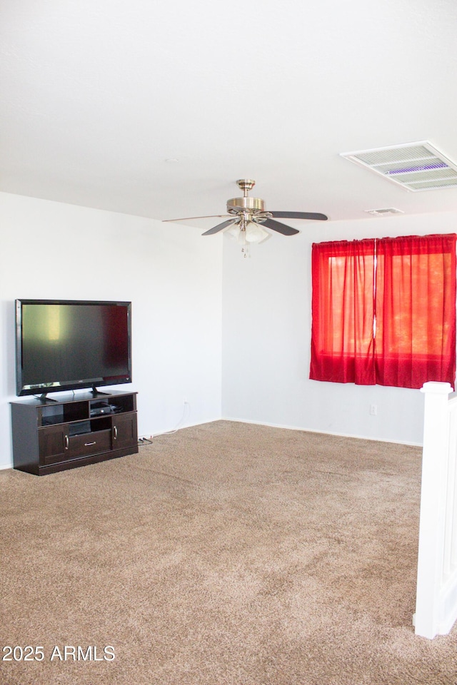 15148 W Sells Dr, Goodyear, AZ 85395 - unfurnished living room with carpet flooring and a ceiling fan