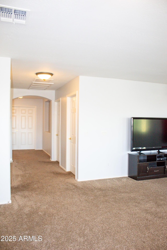 15148 W Sells Dr, Goodyear, AZ 85395 - unfurnished living room featuring carpet floors and arched walkways