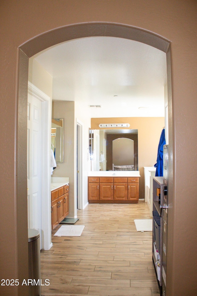 15148 W Sells Dr, Goodyear, AZ 85395 - full bathroom featuring vanity and wood finished floors