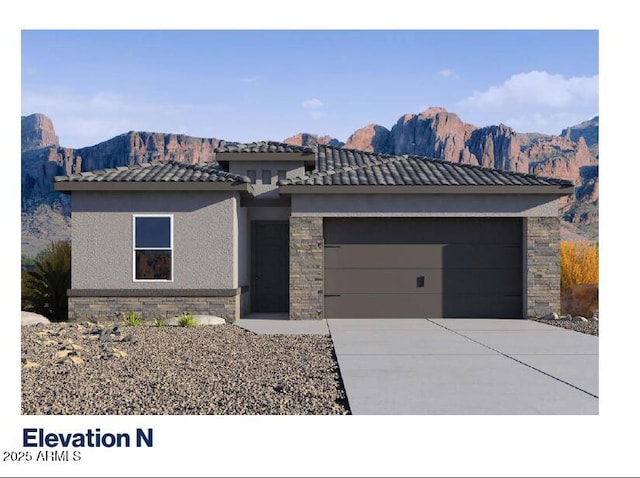 prairie-style house featuring stone siding, stucco siding, a tiled roof, an attached garage, and driveway