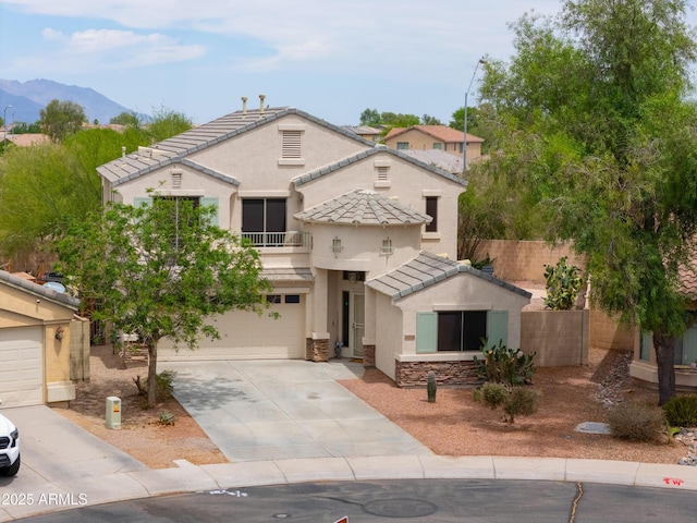 44890 W Desert Garden Rd, Maricopa, AZ 85139 - view of front facade featuring a tiled roof, a garage, concrete driveway, stucco siding, and a mountain view