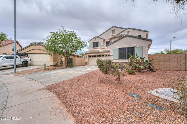 44890 W Desert Garden Rd, Maricopa, AZ 85139 - view of front of home with driveway, an attached garage, and stucco siding
