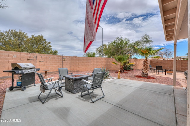 44890 W Desert Garden Rd, Maricopa, AZ 85139 - fenced backyard featuring a fire pit, grilling area, and a patio