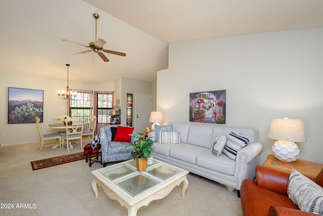 living room with lofted ceiling, light colored carpet, and ceiling fan with notable chandelier